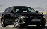 Audi A3. Modelo 2008. Imagen exterior. Frontal lateral. Coche pardo. Carretera. Negro.
