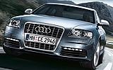 Audi S6. Modelo 2009. Imagen. Berlina. Frontal lateral. Movimiento. Carretera.  Azul boreal efecto perla.