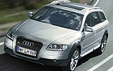 Audi A6 Allroad. Modelo 2009. Frontal lateral cenital. Movimiento. Gris cuarzo metalizado.