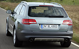 Audi A6 Allroad. Modelo 2009. Imagen. Lateral posterior. Movimiento. Carretera.