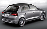 Audi A1 Sportback Concept. Prototipo 2008. Imagen. Posterior- lateral. Coche parado. Pilotos traseros encendidos. Estudio. Gris.