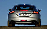 Audi  TTS 2.0 TFSI quattro. Modelo 2009. Coup�. Imagen. Exterior. Posterior. Coche parado. Carretera. Pilotos en on. Plata.