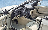 BMW Serie 1 Cabrio. Modelo 2008. Imagen. Interior. Salpicadero. Volante. Asientos de cuero Boston Lemon. Reposabrazos delantero.