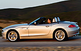BMW Z4. Modelo 2009. Imagen exterior. Lateral. Movimiento. Descapotado. arretera.
