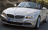 BMW Z4. Modelo 2009. Imagen. Exterior. Frontal lateral. Coche en movimiento. Luces faros en on. Carretera.