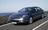 Citro�n C6. Modelo 2008. Imagen. Frontal- lateral. Coche en movimiento. Carretera. Gris Fer nacarado.