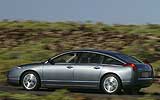 Citro�n C6. Modelo V6 HDi 204 CV. 2008. Imagen. Lateral- posterior. Coche en movimiento. Carretera. Gris Fer nacarado.