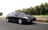 Citro�n C6. Modelo 2008. Imagen. Lateral- frontal. Coche en movimiento. Carretera. Negro Obsidian metalizado.