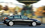 Citro�n C6. Modelo 2008. Imagen. Lateral. Coche en movimiento. Carretera. Negro Obsidian metalizado.