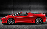 Ferrari 430 Scuderia Spider 16M. Modelo 2009. Imagen exterior. Descapotado. Lateral. Coche parado. Estudio. Rojo.