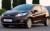 Ford Fiesta. Modelo 2009. Imagen. Frontal lateral. Coche parado. Carretera. Color Negro.