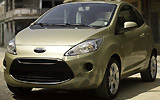 Ford Ka. Modelo 2009. Imagen exterior. Frontal lateral. Coche parado. Carretera. Dorado.