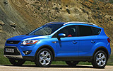 Ford Kuga. Modelo 2009. Imagen. Exterior. Frontal lateral. Coche parado. Carretera. Azul.