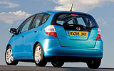 Honda Jazz. Modelo 2009. Imagen. Lateral- posterior. Coche parado. Carretera. Azul.