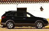 Hyundai ix55. Modelo 2009. Imagen. Exterior. Lateral. Parado. Coche en carretera. Color Ebony Black.
