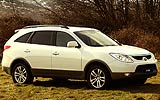 Hyundai ix55. Modelo 2009. Imagen. Exterior. Lateral frontal. Coche parado. Carretera. Color Vanilla White.