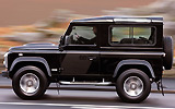 Land Rover Defender 90 SW SVX. Modelo 2008. Imagen. Exterior. Lateral. Coche en movimiento. Carretera. Negro.