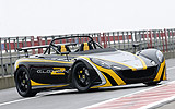 Lotus 2-Eleven. Gama 2008. Imagen. Lateral frontal. Coche parado. Carretera. Biplaza.