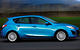 Mazda3. Modelo 2009. Imagen. Exterior. Lateral. Coche en movimiento. Carretera. Color Celestial Blue Mica.
