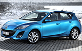 Mazda3. Modelo 2009. Imagen. Exterior. Frontal lateral. Coche parado. Carretera. Color Celestial Blue Mica.