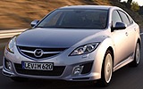 Mazda6. Modelo 2008. Kit deportivo (SAP). Imagen. Frontal- lateral. Coche en movimiento. Carretera. Color Gris.