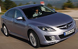 Mazda6. Modelo 2008. Kit deportivo (SAP). Imagen. Lateral- frontal. Coche en movimiento. Carretera. Color Gris.