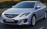 Mazda6. Modelo 2008. Kit deportivo (SAP). Imagen. Frontal- lateral. Coche en movimiento. Coche en arretera. Color Gris.