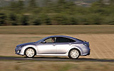 Mazda6. Modelo 2008. Kit deportivo (SAP). Imagen. Lateral. Coche en movimiento. Carretera. Color Gris.