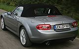 Mazda MX-5. Soft Top. Modelo 2009. Imagen exterior. Posterior. Movimiento. Carretera. Gris.