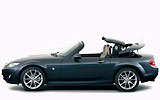 Mazda MX-5. Roadster Coup&eacute;. Modelo 2009. Imagen exterior. Lateral. Coche parado. Techo met&aacute;lico plegable. Estudio. Gris oscuro.