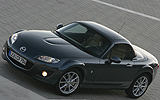 Mazda MX-5. Roadster Coup&eacute;. Modelo 2009. Imagen exterior. Frontal lateral. Carretera. Gris.