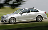 Mercedes-Benz Clase C BlueEFFICIENCY. Modelo 2009. Imagen. Lateral. Coche en movimiento. Carretera. Gris.