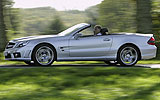 Mercedes-Benz SL 65 AMG. Modelo 2008. Imagen. Lateral. Coche en movimiento. Descapotado. Carretera. Plata iridio.