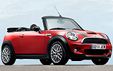 MINI John Cooper Works Cabrio. Modelo 2009. Imagen. Exterior. Lateral frontal. Coche parado. Carretera. Rojo.