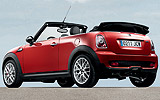 MINI John Cooper Works Cabrio. Modelo 2009. Imagen. Exterior. Lateral posterior. Coche parado. Carretera. Rojo.