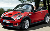 MINI John Cooper Works Cabrio. Modelo 2009. Imagen. Exterior. Frontal lateral. Movimiento. Carretera. Rojo.