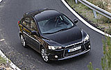 Mitsubishi Lancer Sportback. Modelo 2009. Imagen exterior. Frontal cenital. Movimiento. Carretera. Negro