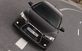 Mitsubishi Lancer Sportback. Modelo 2009. Imagen exterior. Frontal. Coche parado. Carretera. Negro
