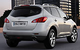 Nissan Murano. Modelo 2009. Imagen. Posterior- lateral. Coche parado. Carretera. Gris.