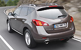 Nissan Murano. Modelo 2009. Imagen. Lateral- posterior. Coche en movimiento. Carretera. Marr�n.
