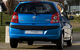 Nissan Pixo. Modelo 2009. Imagen. Exterior. Posterior. Coche parado. Carretera. Azul.