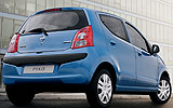 Nissan Pixo. Modelo 2009. Imagen. Exterior. Posterior lateral. Coche parado. Carretera. Azul.