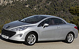 Peugeot 308 CC. Modelo 2009. Imagen. Exterior. Frontal lateral. Coche parado. Carretera. Gris aluminio.