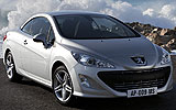 Peugeot 308 CC. Modelo 2009. Imagen. Exterior. Lateral frontal. Coche parado. Carretera. Techo r�gido plegable. Gris aluminio.