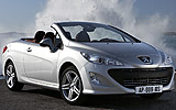 Peugeot 308 CC. Modelo 2009. Imagen. Exterior. Lateral frontal. Coche parado. Carretera. Descapotado. Gris aluminio.