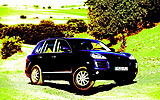 Porsche Cayenne. Modelo 2008. Imagen. Exterior. Lateral frontal. Coche parado. Cruce de ejes. Azul marino.