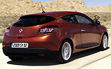 Renault M�gane Coup�. Modelo 2009. Imagen exterior. Tres puertas. Posterior lateral. Movimiento. Carretera. Naranja.