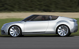 Saab 9-X Air. Prototipo 2008. Imagen. Lateral. Coche en movimiento. Carretera. Gris.