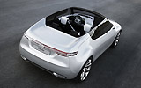 Saab 9-X Air. Prototipo 2008. Imagen. Posterior- lateral- cenital. Coche parado. Carretera. Descapotado. Gris.