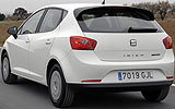 SEAT Ibiza ECOMOTIVE. Modelo 2009. Imagen. Exterior. Lateral posterior. Coche en movimiento. Carretera. Blanco.